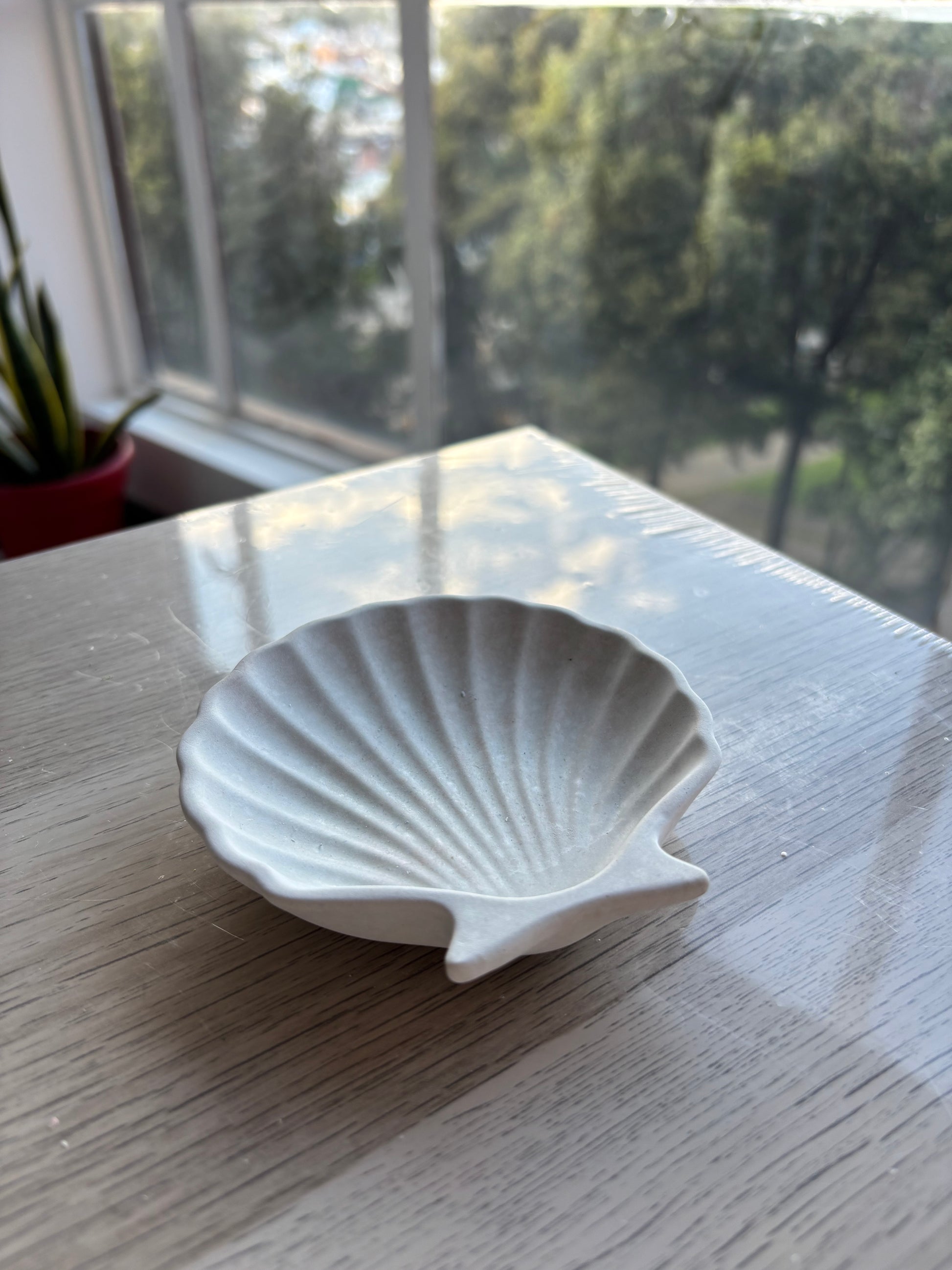 Recipiente en cemento para velas concha de mar